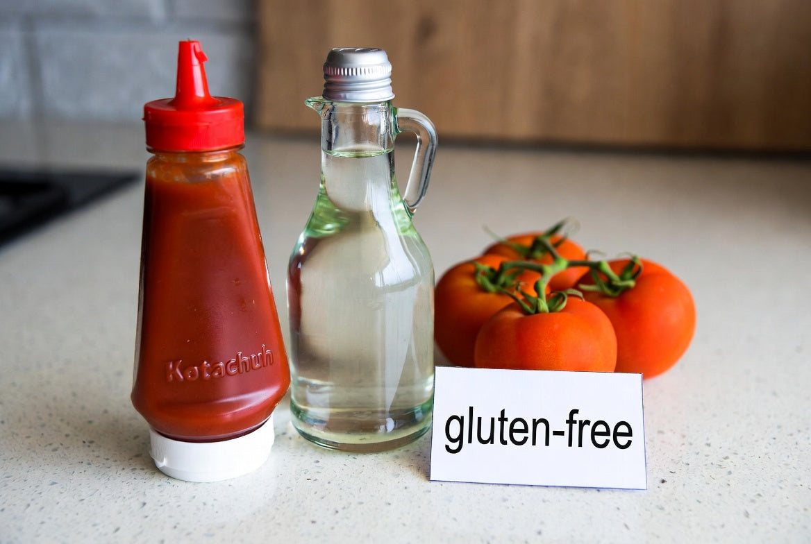 Ketchup, vinegar, tomatoes, and gluten-free label on counter