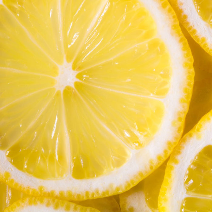 Close-up of fresh lemon slices showing bright yellow texture
