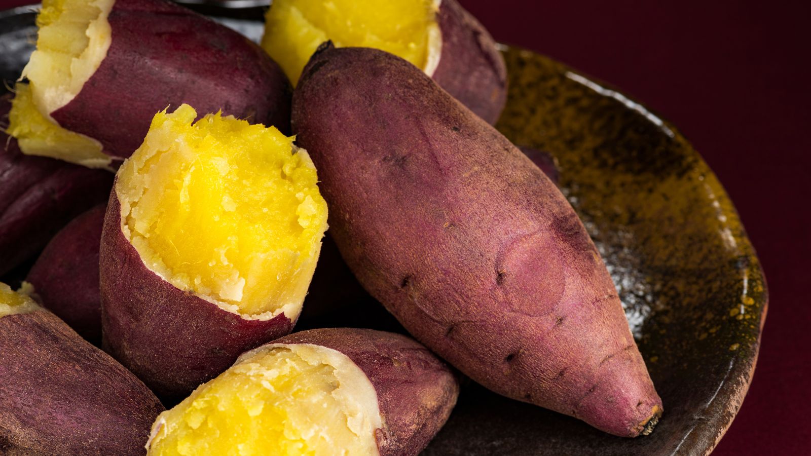 Steamed sweet potatoes with purple skin and golden yellow flesh