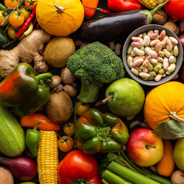 Colorful assortment of fresh fruits, vegetables, and legumes.