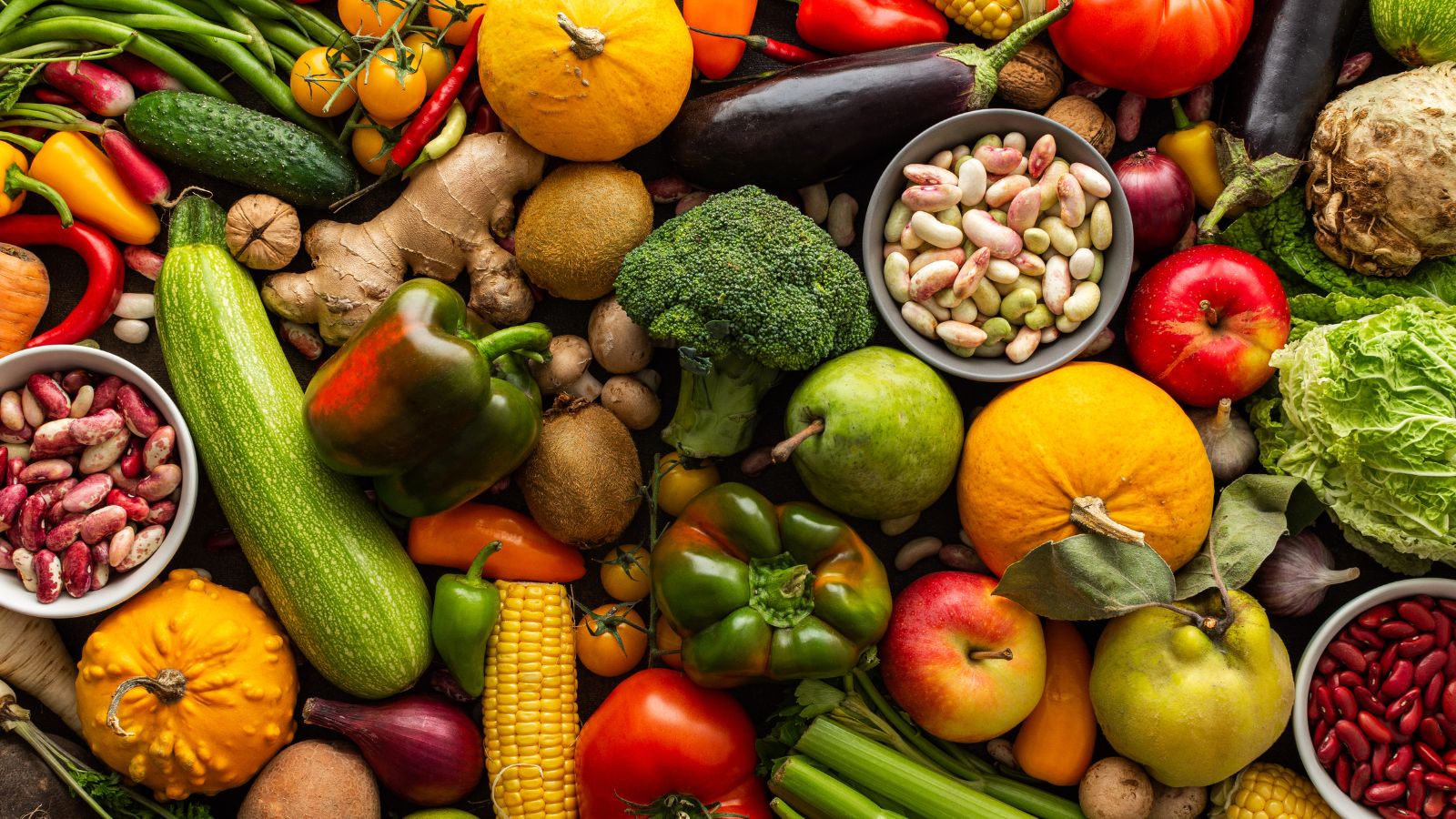 Colorful assortment of fresh fruits, vegetables, and legumes.