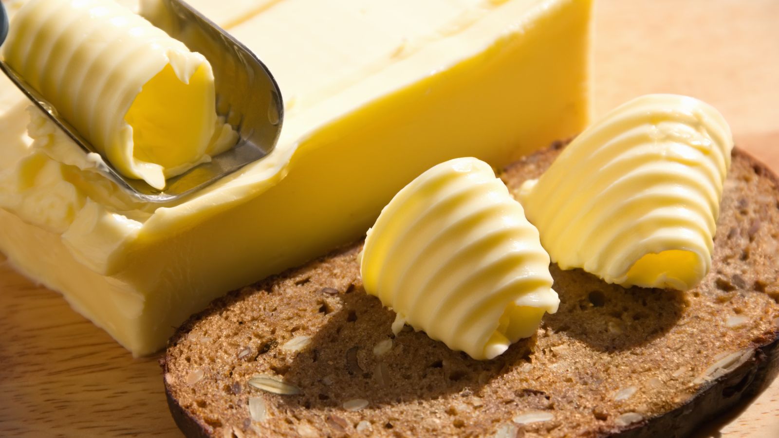 Butter curls on whole grain bread with a butter slicer.