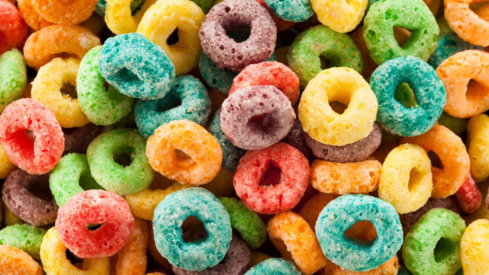 Colorful fruit-flavored cereal rings in a close-up view