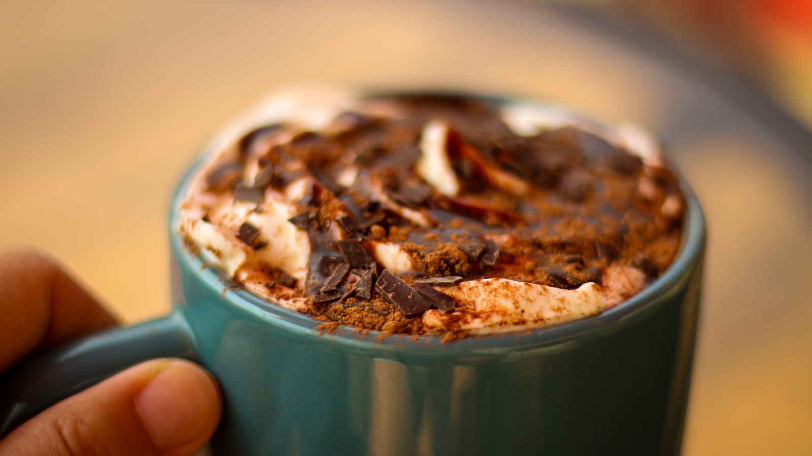 Close-up of hot mocha with whipped cream and chocolate shavings