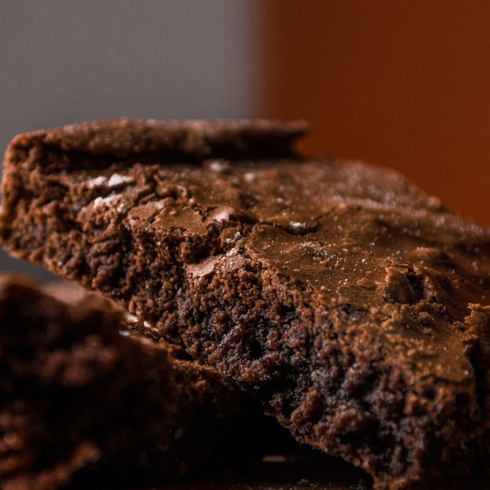 Closeup of rich fudgy brownie with crackly top layer