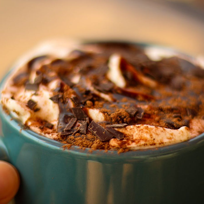 Close-up of hot mocha with whipped cream and chocolate shavings