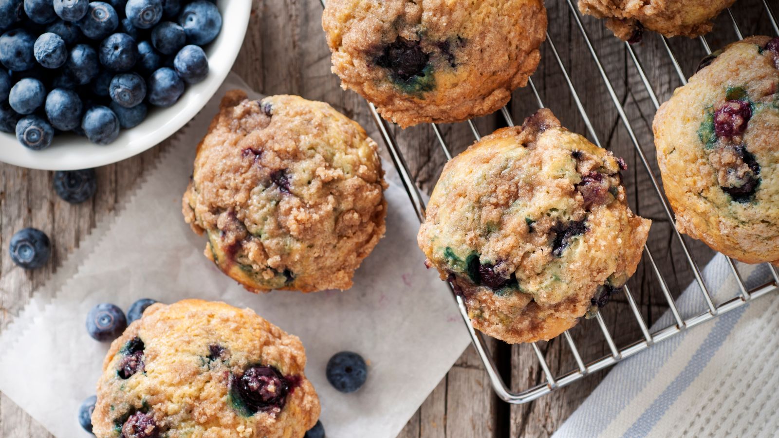 Freshly baked blueberry muffins with a crispy crumble topping