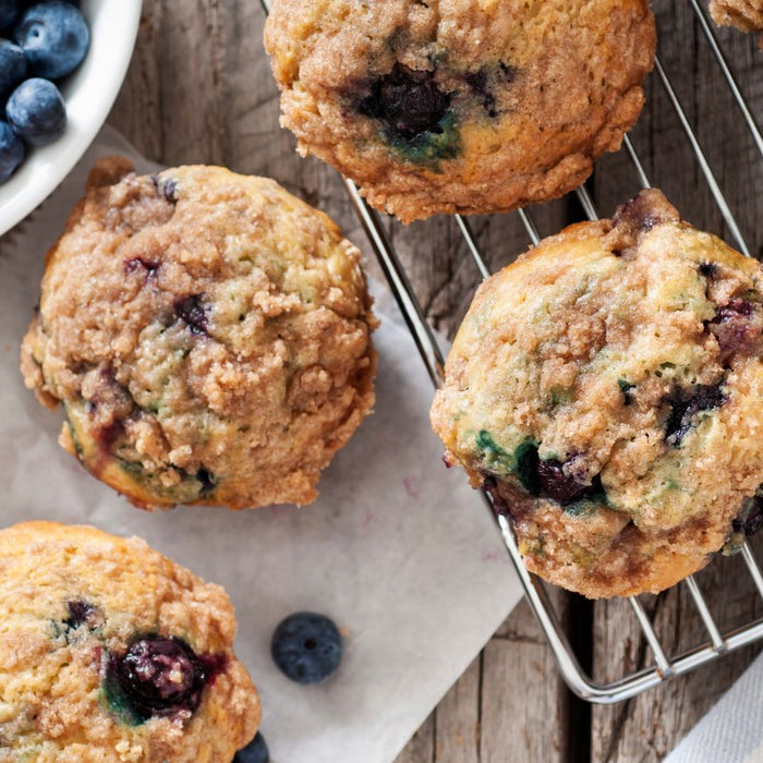 Freshly baked blueberry muffins with a crispy crumble topping