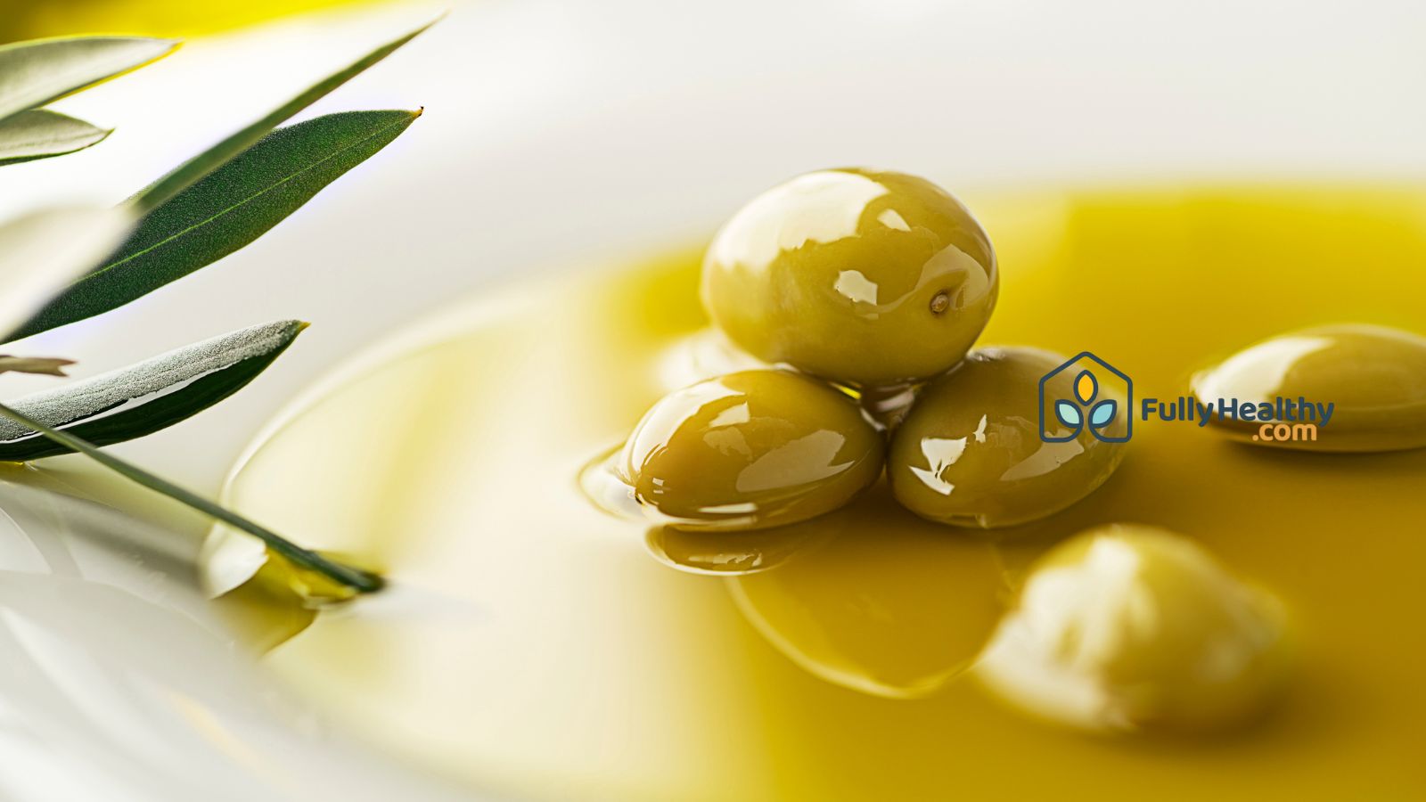 Close-up of green olives in olive oil for healthy Mediterranean diet.