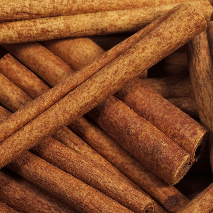 Close-up of dried cinnamon sticks in a pile.