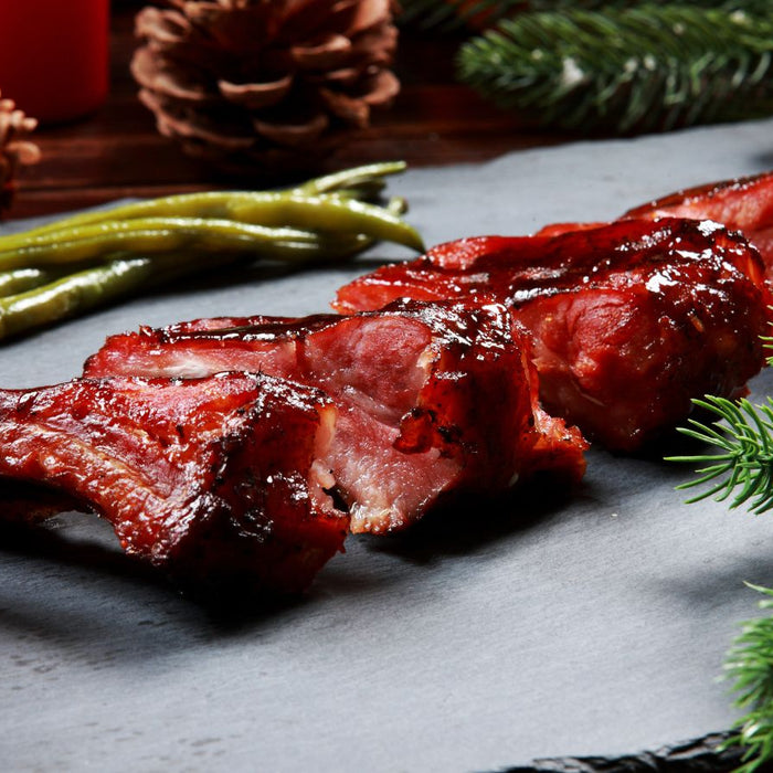 Barbecue ribs served with green beans and holiday decor.
