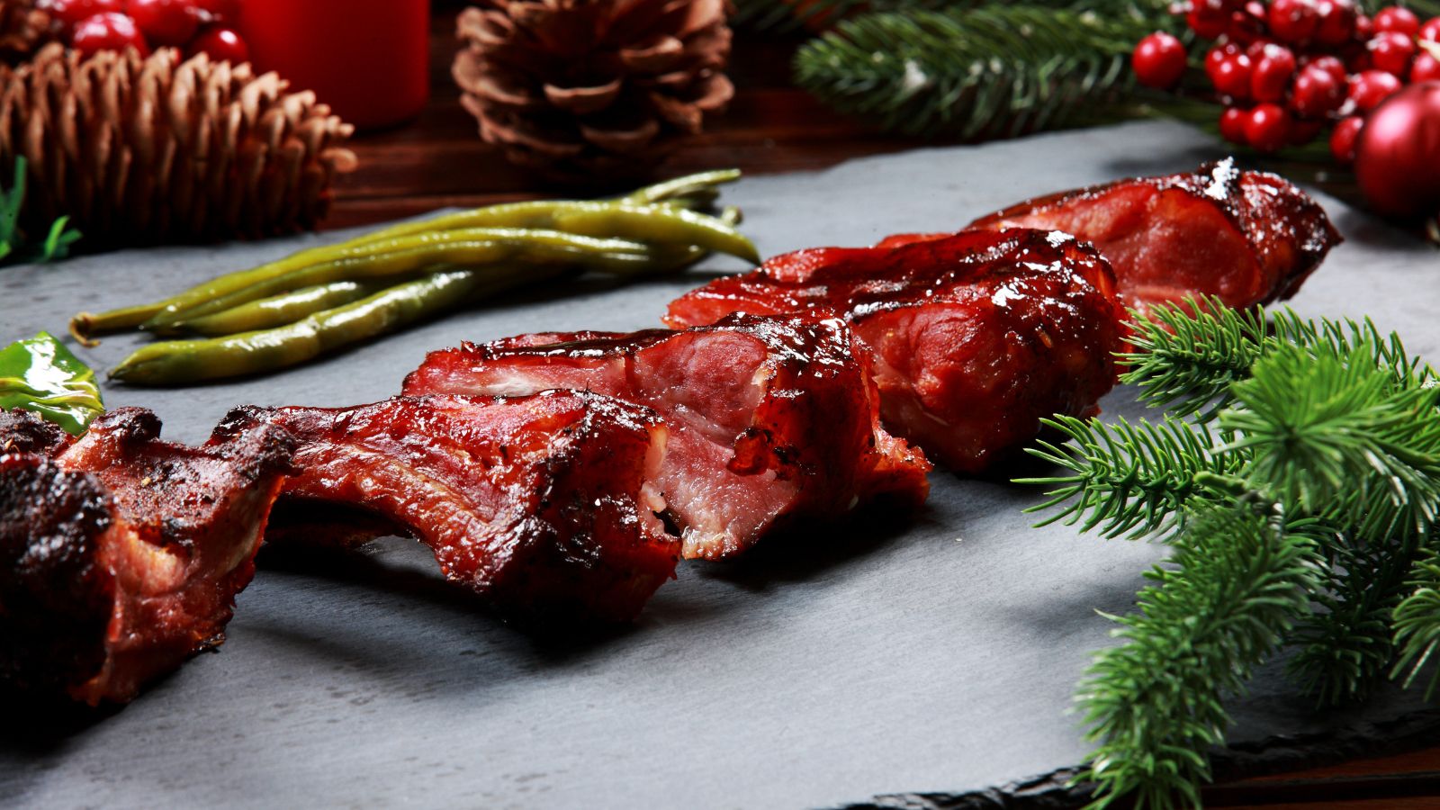 Barbecue ribs served with green beans and holiday decor.