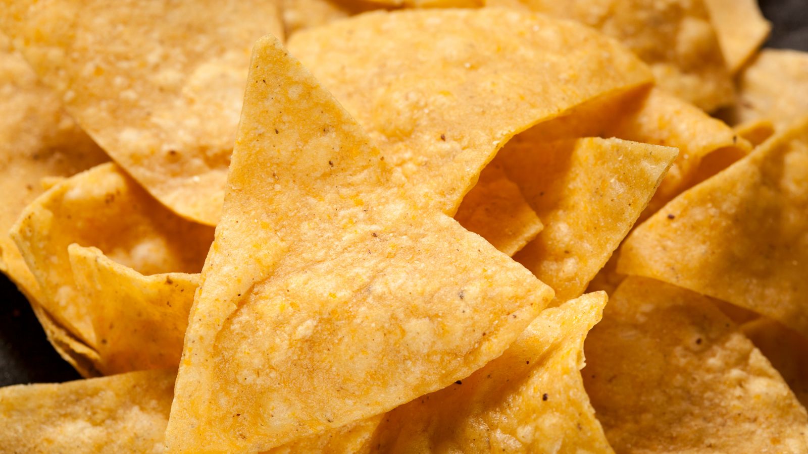 Close-up of crunchy golden tortilla chips ready to be served