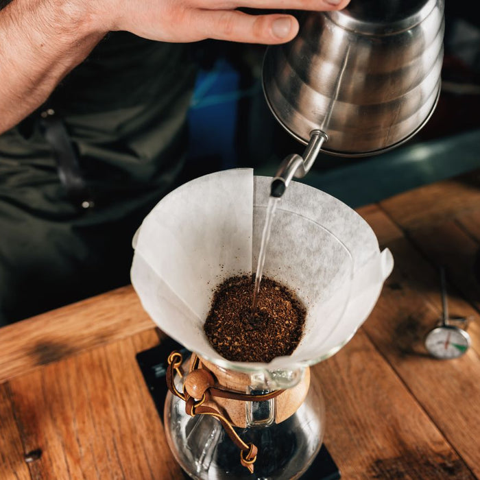 Pour-over coffee being brewed with a gooseneck kettle