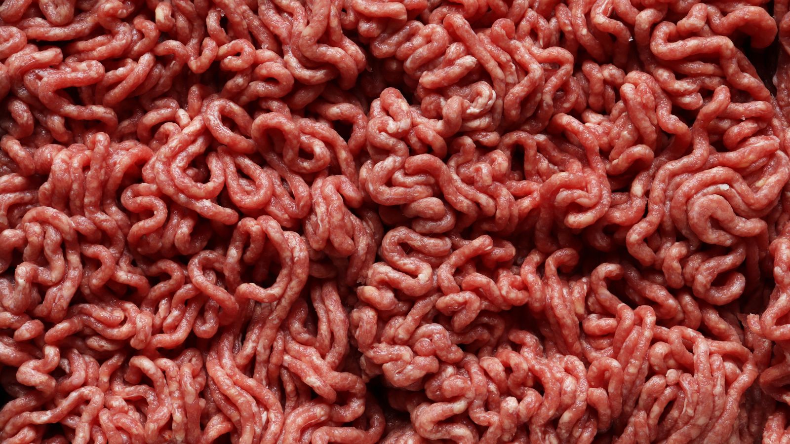Close-up view of raw ground beef with texture details.