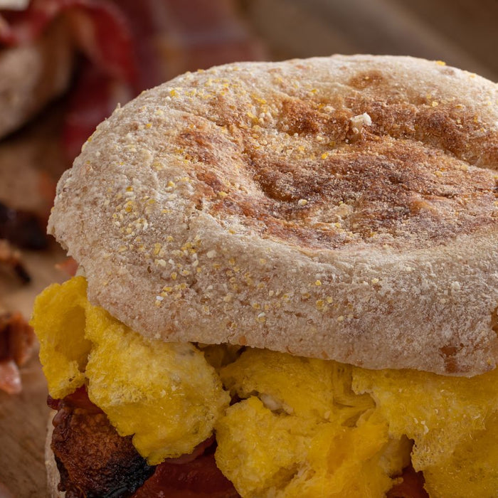 Bacon and scrambled egg breakfast sandwich on English muffin.
