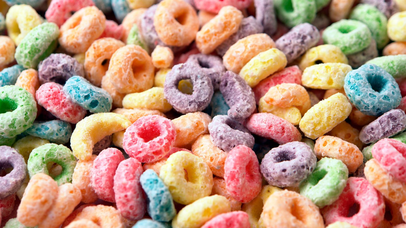 Colorful fruit cereal loops close-up in vibrant mixed colors