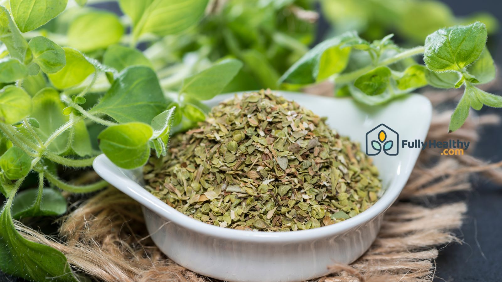 Fresh oregano leaves and dried oregano in white bowl.