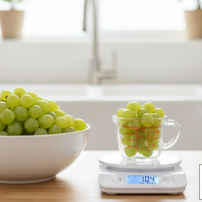 Green grapes measured in cup on scale showing 104 calories