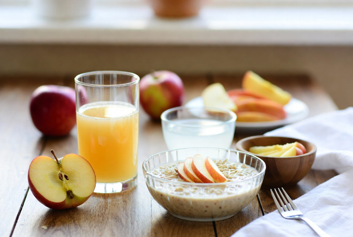 Apple juice with sliced apples and breakfast foods
