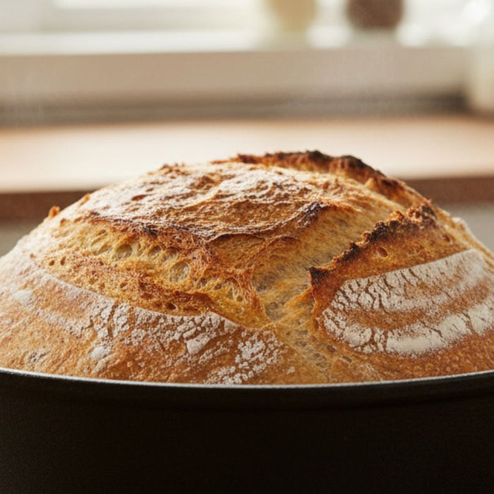 Artisan sourdough bread baked in cast iron pot