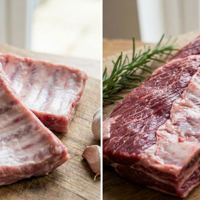 Raw beef ribs and slab of meat on wooden board with garlic