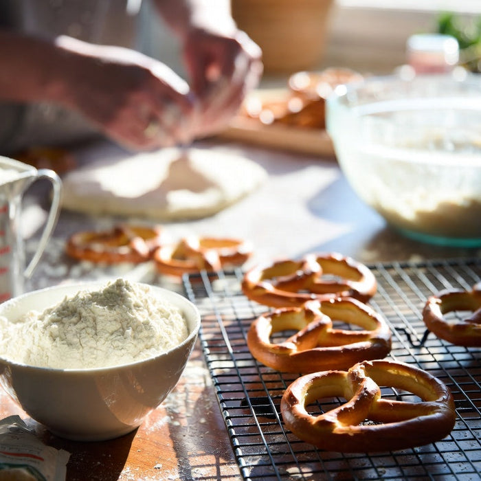 Freshly baked gluten-free pretzels cooling on a wire baking rack