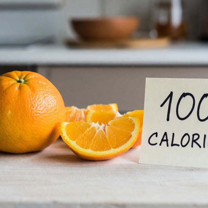 Orange slices with calorie note on kitchen countertop