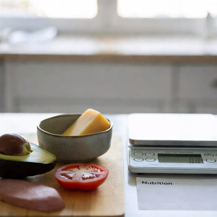 Avocado with proteins on cutting board beside nutrition note